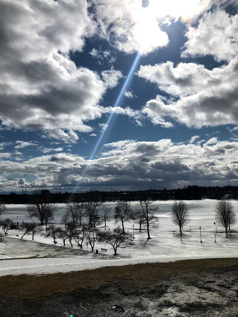 Photo of an icy scene with a sun ray