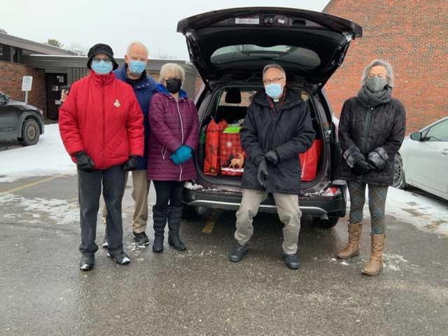 (L-r) Lois Wynn and Peter Martin from St. Aidan’s met up with Marilyn Bedard, Rev. Tim Kehoe and Kathryn Fournier from St. Thomas to make the delivery. Missing from the photo is Cathy Munroe from St. Thomas.