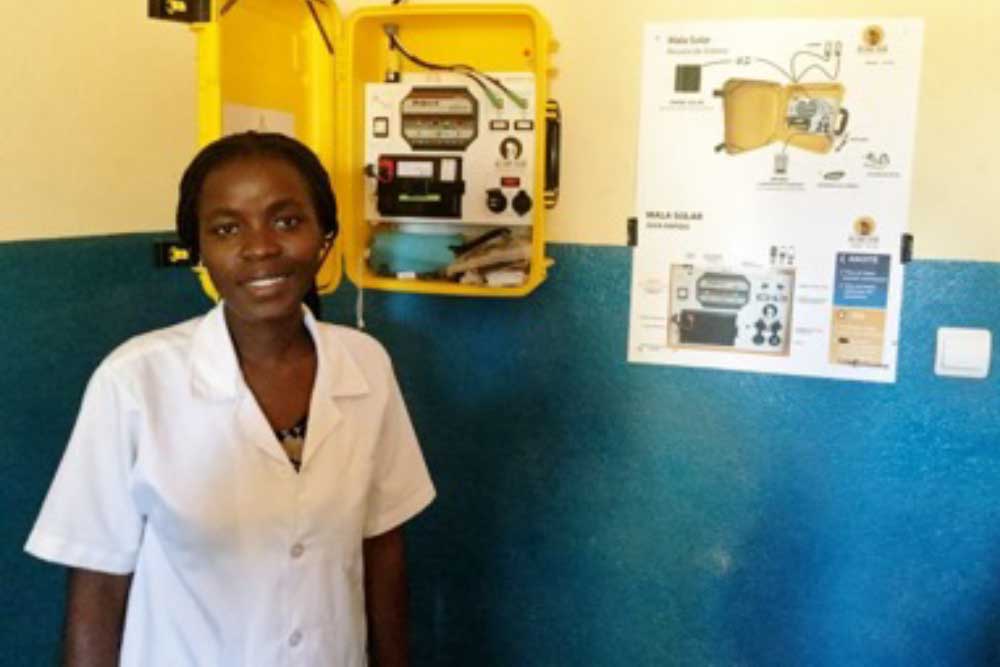 Young woman in front of a solar suitcase