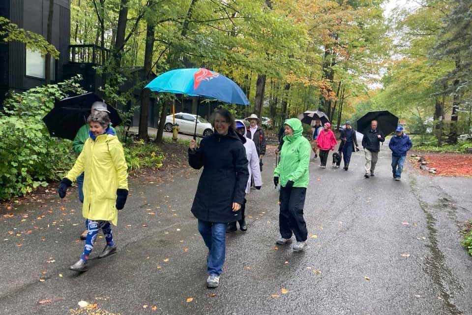 Photo of people walking in the rain