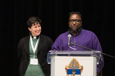 The Rev. Simone Hurkmans and Paul Mugarura address Synod.