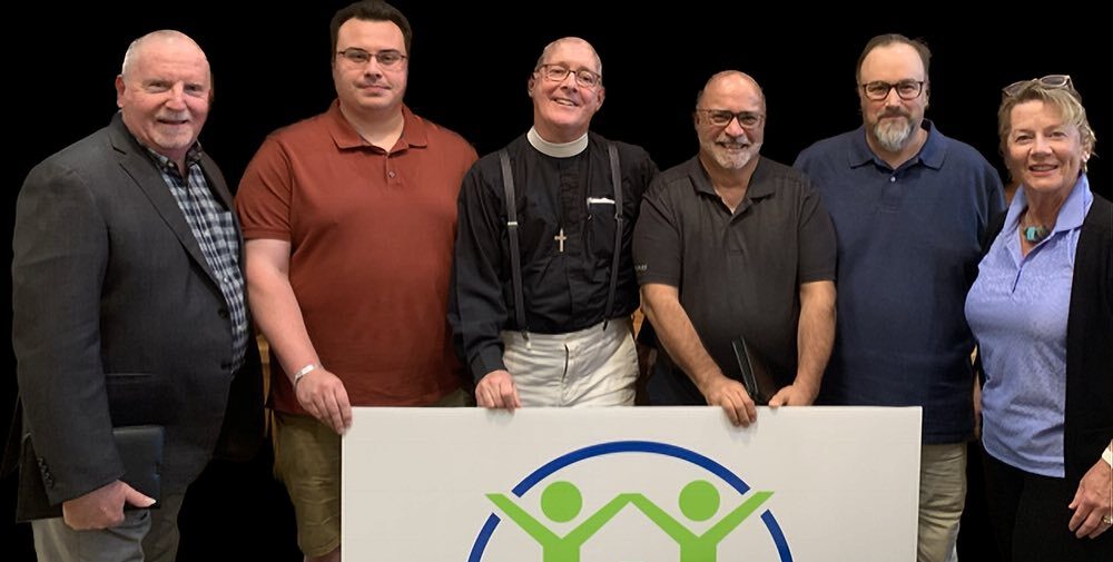Brian Perkins; Marc Girouard, Carebridge operations director; The Rev. Canon Ken Davis; David Kroetsch of St James, co-chair of CCHIP; Rob Eves, Carebridge CEO and Claire Smith, CCHIP co-chair of fundraising.