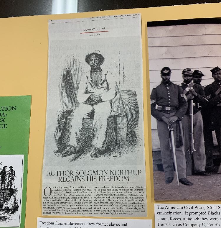 Black History Month display with photos and text at the Diocesan Archives.