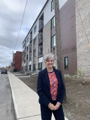 Tammy Mulrooney stands outside the new building