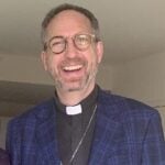 Shawn Pankow and the Rev. Thomas Brauer tour one of the new apartments.