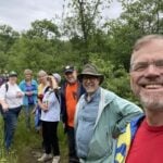 The Rev. Canon Gary van der Meer with St. John's parishioners on the walk.