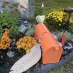 The grave of Dr. Peter Bryce in Beechwood Cemetery has an orage mailbox.