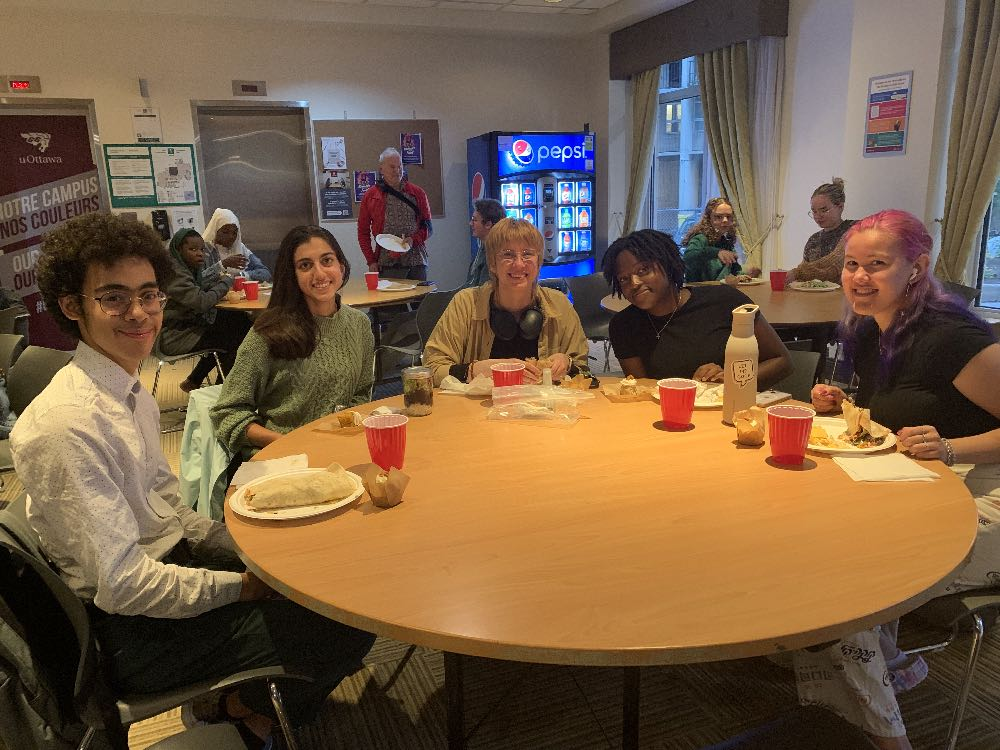 Student guests enjoy a meal hosted by St. Albans at the Friel residence on campus.