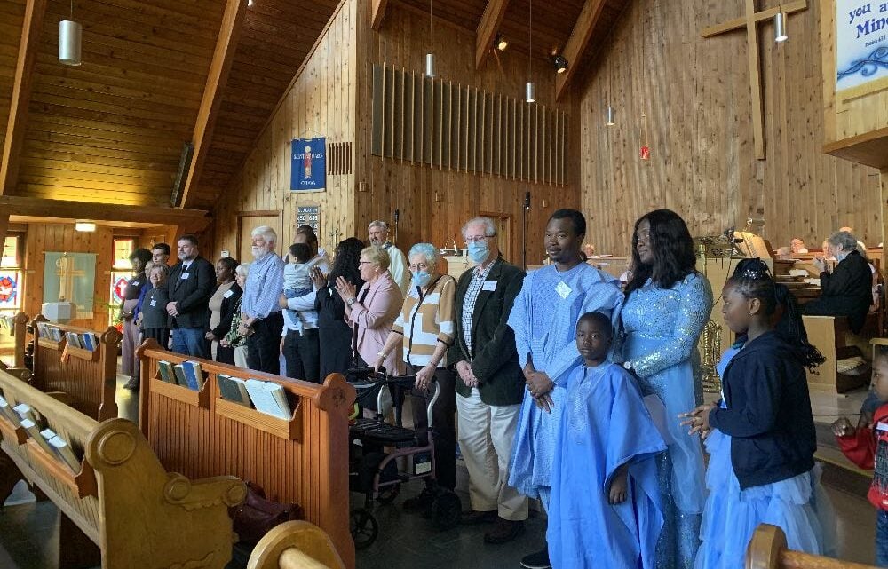 New parishioners at the front of the church