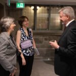 Bishop Shane Parker chats with the Rev. Maria Nightingale and her daughter Angeliqe.