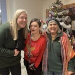 Heather, India and Mary by the Christmas tree.