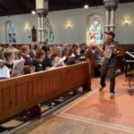 Andrew Balfour working with the singers in the workshop.