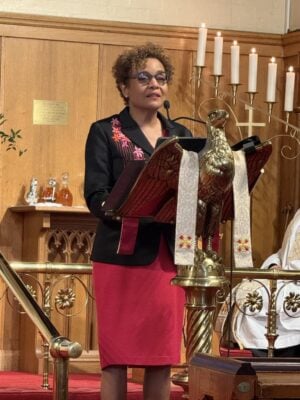 The Right Honourable Michaëlle Jean reads at the lectern.