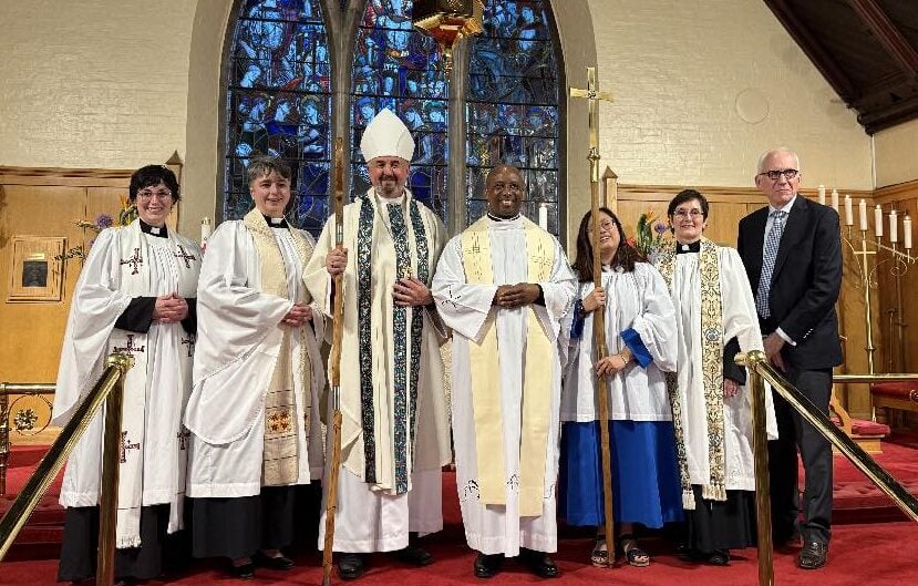Clergy gather by the St. Bart's altar after the service
