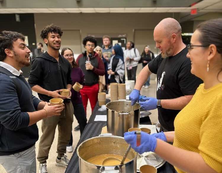 The Rev. Michael Garner and St. Albans parishioners serve soup to students at the University of Ottawa.