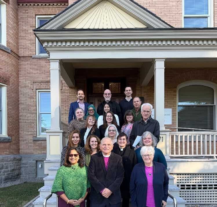 Staff at Ascension House standing on the front steps of Ascension House.