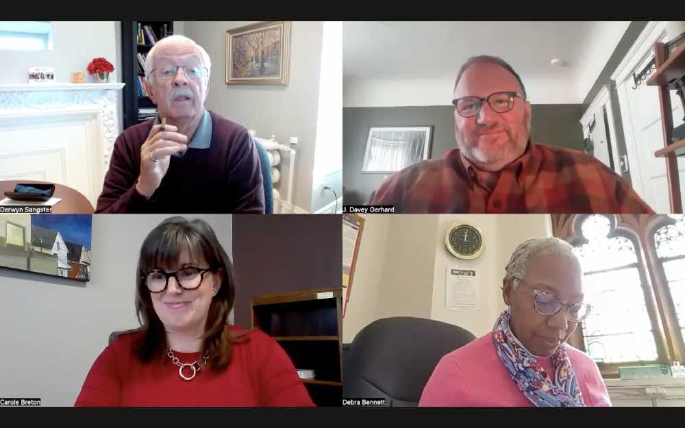 Screenshot of two men and two women on a Zoom screen