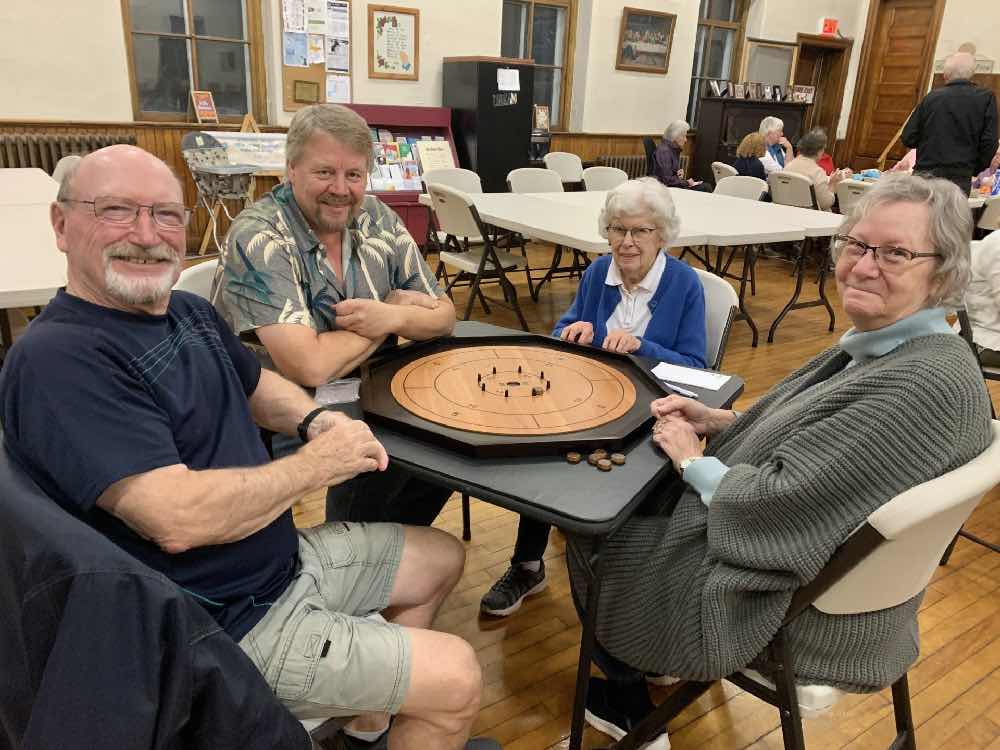 People play board games at St. John the Evangelist, Smiths Falls