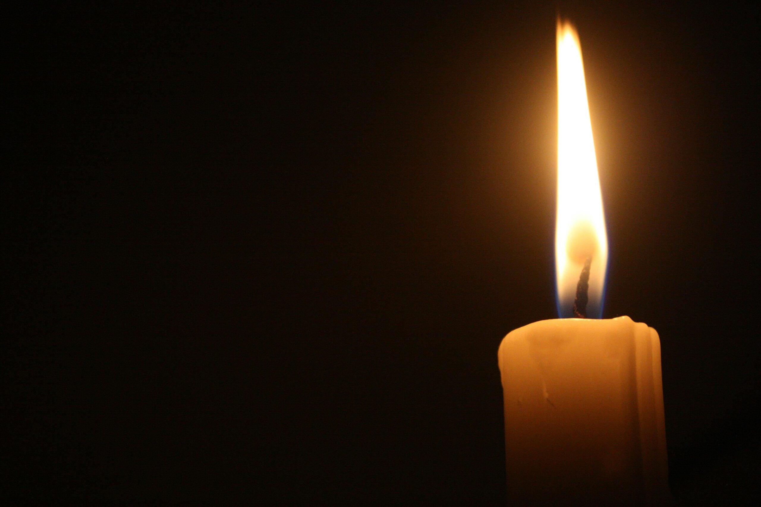 Candle flame, dark background