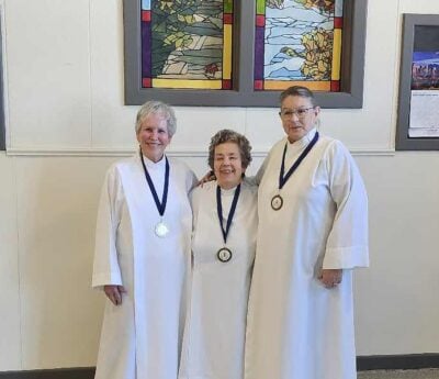 The Licensed Lay Readers of West Quebec — Jean Macnab, Monica Dodson and Deborah Bergeron—with their new medallions. 
