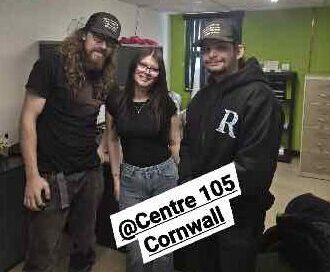 Two Strong Christian Boys pose with Centre 105's Melodie Cousineau for a social media post.