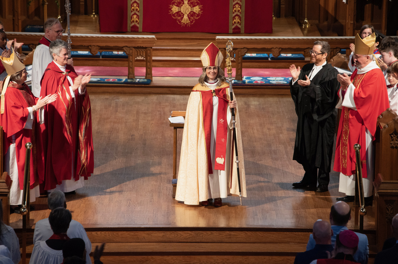 Bishop Kathryn Otley in Christ Church Cathedral with clergy and Chancellor around her