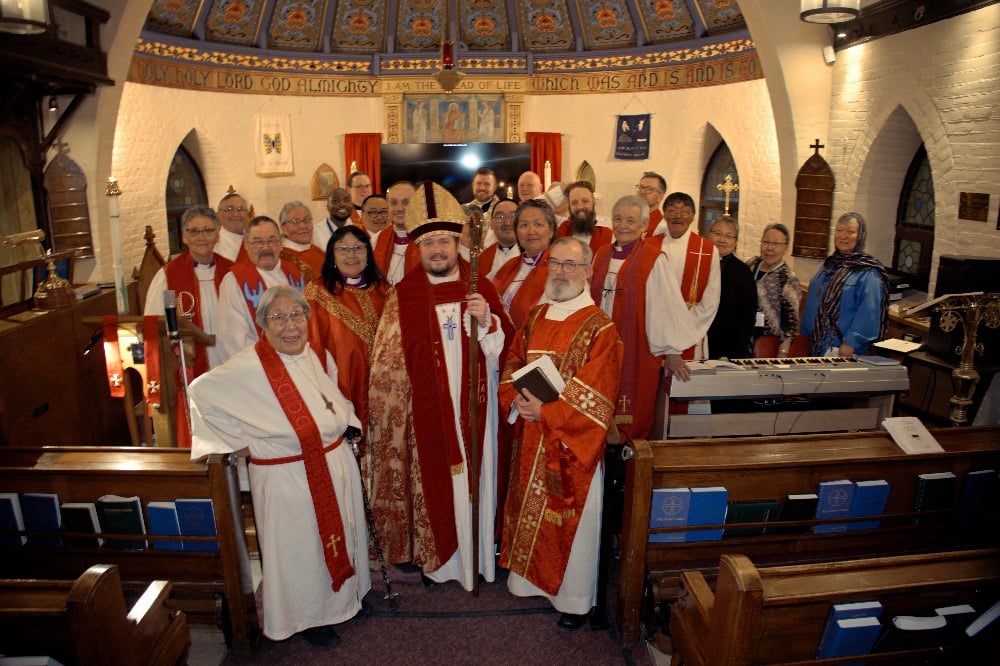 Inuit and non-Inuit clergy gather with Bishop Alexander Pryor of the Diocese of the Arctic in St. Margaret's Vanier in Ottawa.