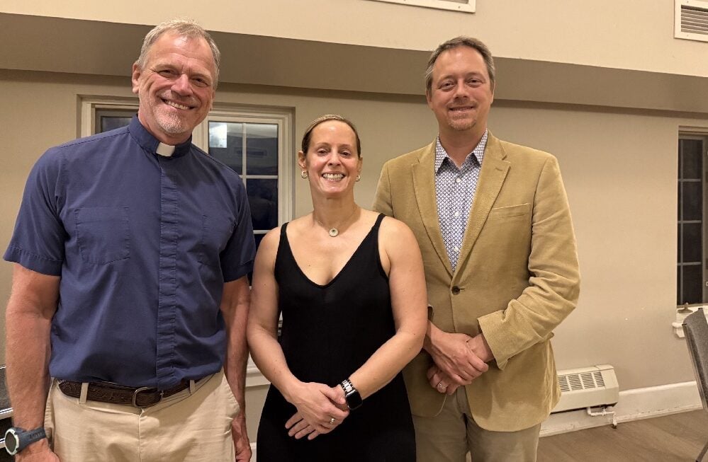 The Rev. Canon Gary van der Meer thanked guest speakers guest speakers Dr. Justine  Amaro and Dr. James Downar pause for a photo in the parish hall.