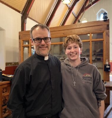 Deacon Jarrett Carty and Belong Ottawa staffer Kylee smile at an event to honour Belong Ottawa volunteers at St. Albans Church. 