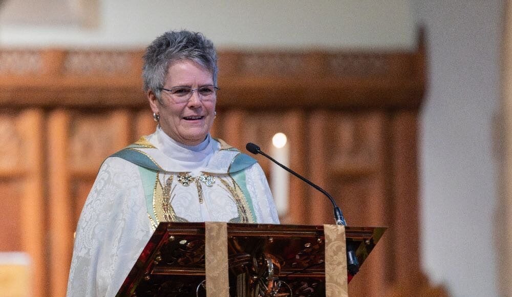 Dean Beth Bretzlaff speaking in Christ Church Cathedral Ottawa (in a white and gold cope on a New Year's Day service)