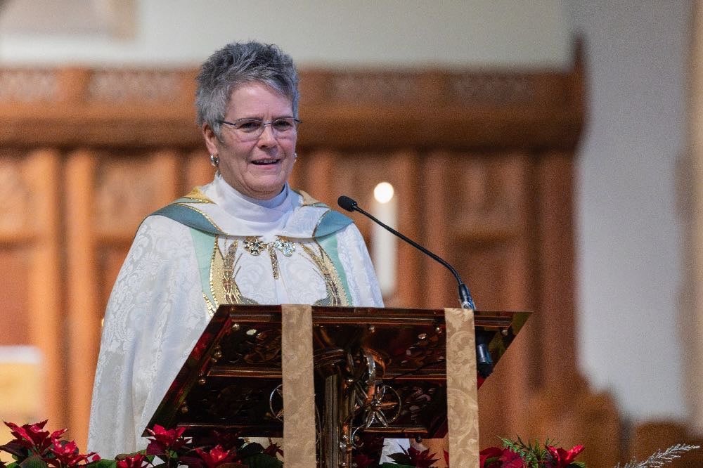 Dean Beth Bretzlaff speaking in Christ Church Cathedral Ottawa (in a white and gold cope on a New Year's Day service)