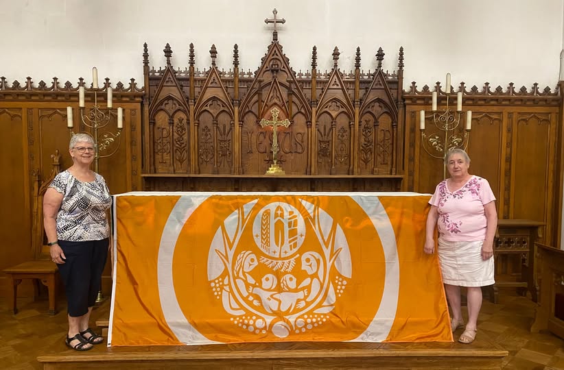 Two women with the memorial cloth