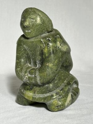 An Inuit sculpture in green soapstone