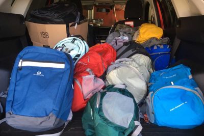 Packed with care: Diocesan youth sent 30 backpacks filled with personal items to homeless youth.