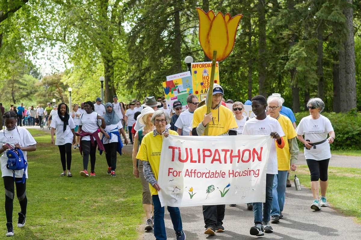 Anglicans participating in Tulipathon holding a sign