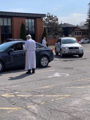 Holy Communion in a parking lot
